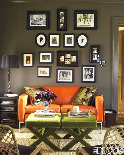 dark grey walls orange sofa table interiors.jpg